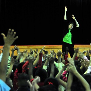 Hannah Kahn leading students in stretching